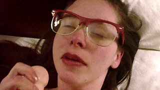 Ugly bitch with glasses stretches her mouth lips filling it with huge dildo