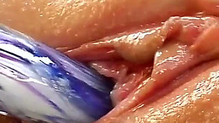 Oiled Blonde Stretches Her Pussy with a Thick Glass Dildo