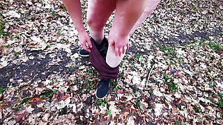 Completely naked in the woods and slapping pussy