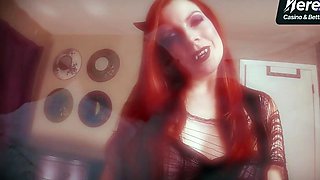 A redheaded succubus in black lace with kink