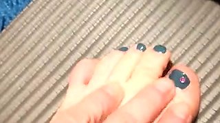 Brunette with foot fetish rubs big dick with her feet in POV