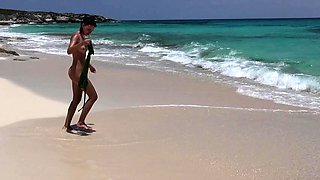 Brunette babe erotica herself on beach