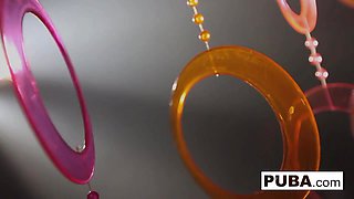 A pair of attractive women with a 70s vibe make each other cum