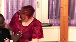 Redhead old boss is fucked by black help with a big cock in the office