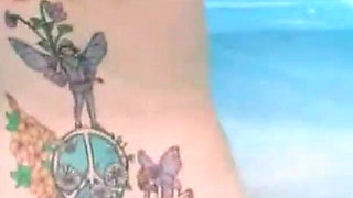 Curly-haired Babe Masturbates with Bottle in Hot Tub