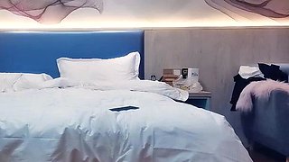 Cute amateur asian web cam girl playing with her toy