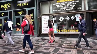 Two attractive European babes expose themselves in public