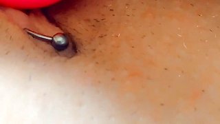 Pink dildo fucks pierced cunt