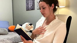 Voyeur of sexy brunette reading a hot romance novel and