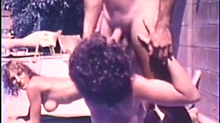 Outdoor interracial orgy fuck by the swimming pool