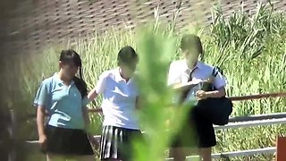 Asian school teens peeing