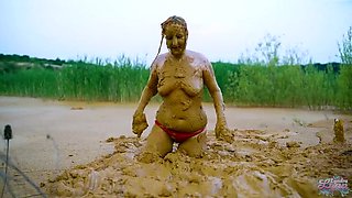 German teen masturbates to orgasm in muddy lake - wet and messy solo fingering