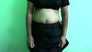 This is a hot video of a Bangla housewife who is stripping