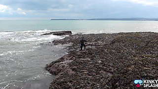 Rubbery Beach Encounter: Lucy's Neoprene Pussy Play with Stranger