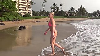 Sultry Tiffany flaunts her curves in a skimpy bikini at the sandy shore