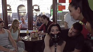 Publicly humiliated sub sucking cock with voyeurs watching
