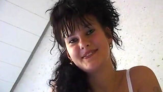 Horny girl lays in bed finger fucking herself and stroking clit