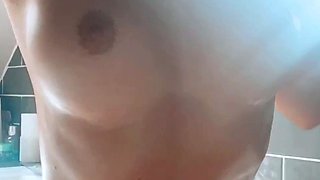 Amateur bikini clad babe oils up her big ass outdoors