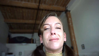 Elise Graves is filmed while struggling in tight rope bondage