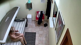 Older MILF Tanning her Shaved Tight Pussy