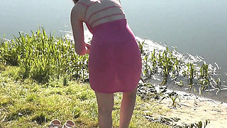 Beautiful Cute Girl Assol Sunbathes on River Bank on Wild Beach in a Dress Without Panties and Naked in Public Outdoors Outside