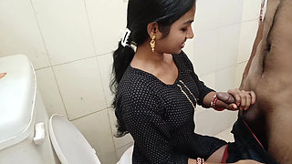 While Bhabhi was sitting on the toilet doing potty, I was watching porn and fingering her pussy.