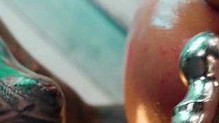 Oiled up Lesbians Share a Metal Toy