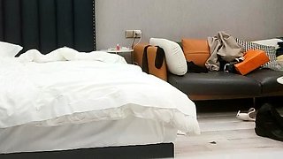 Cute amateur asian web cam girl playing with her toy